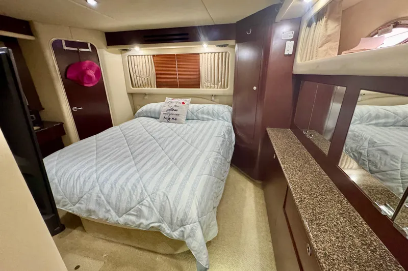 A Mi Manera Yacht Photos Pics Luxurious bedroom interior of 2007 Sea Ray 40 Motor Yacht with cozy bedding.