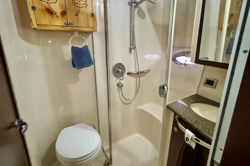 A Mi Manera Yacht Photos Pics Bathroom interior of 2007 Sea Ray 40 Motor Yacht with shower and vanity.