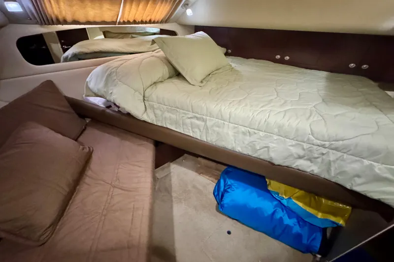 A Mi Manera Yacht Photos Pics Cozy bedroom interior of 2007 Sea Ray 40 Motor Yacht with comfortable bedding.