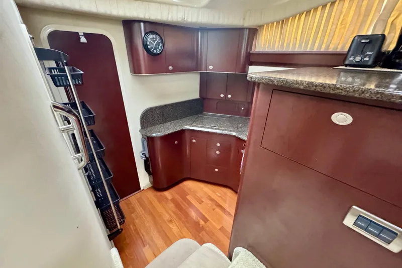 A Mi Manera Yacht Photos Pics 2007 Sea Ray 40 Motor Yacht interior with wood cabinetry and granite countertops.