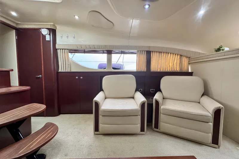 A Mi Manera Yacht Photos Pics Luxurious interior of 2007 Sea Ray 40 Motor Yacht with plush seating and elegant wood finishes.