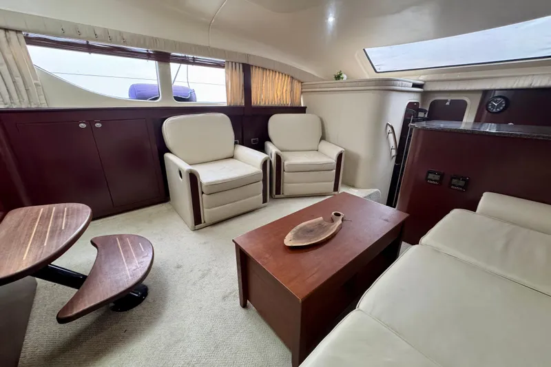 A Mi Manera Yacht Photos Pics Luxurious interior of 2007 Sea Ray 40 Motor Yacht with elegant seating and wooden accents.