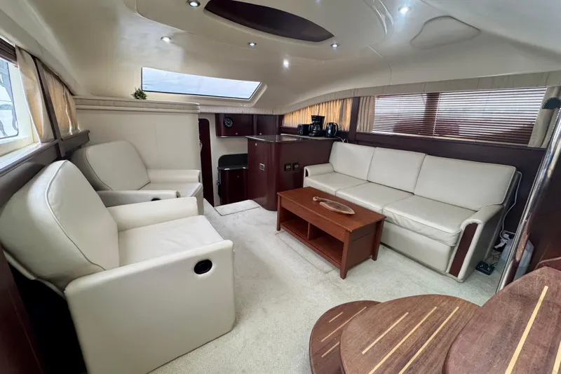 A Mi Manera Yacht Photos Pics Luxurious interior of 2007 Sea Ray 40 Motor Yacht with plush seating and wooden accents.