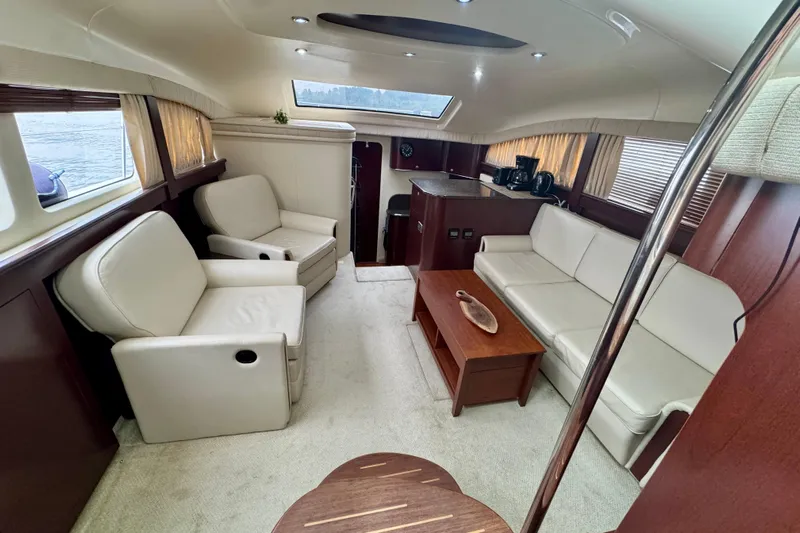 A Mi Manera Yacht Photos Pics Luxurious interior of a 2007 Sea Ray 40 Motor Yacht with elegant seating and wooden accents.