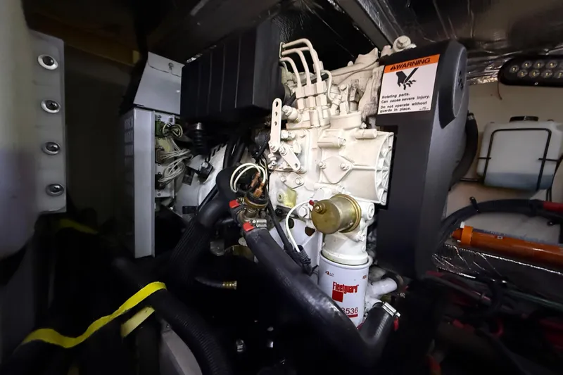 A Mi Manera Yacht Photos Pics Engine compartment of a 2007 Sea Ray 40 Motor Yacht, showcasing mechanical components and wiring.