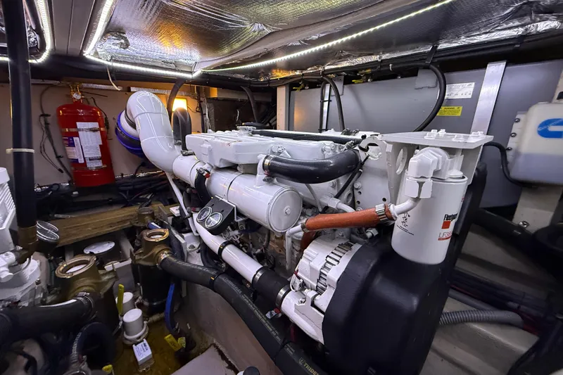 A Mi Manera Yacht Photos Pics Engine room of 2007 Sea Ray 40 Motor Yacht with visible components and fire extinguisher.