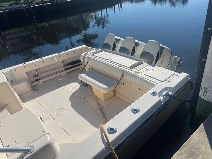  Yacht Photos Pics 2006 Grady-White 360 Express boat docked, featuring spacious deck and triple outboard engines.