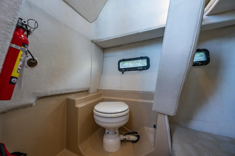 The Western Yacht Photos Pics 2014 Ranger Tugs R-31CB boat interior with toilet and fire extinguisher.
