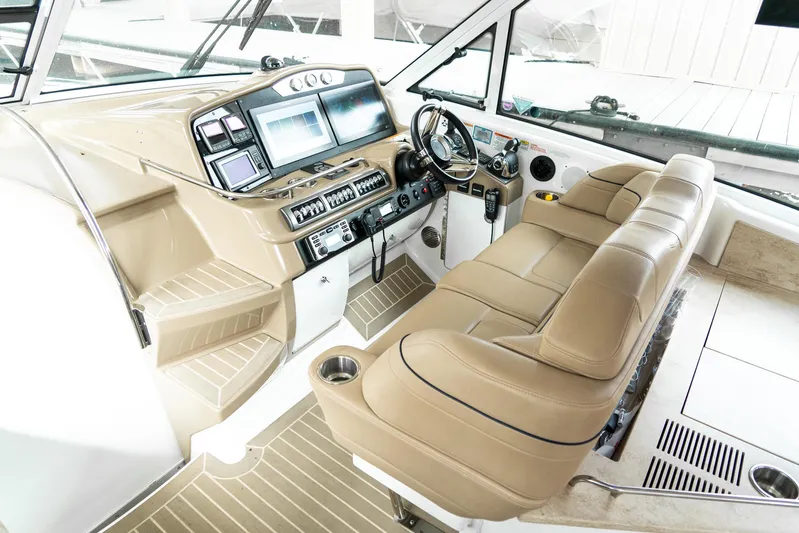  Yacht Photos Pics 2016 Formula 45 Yacht cockpit with beige seating and advanced navigation controls.