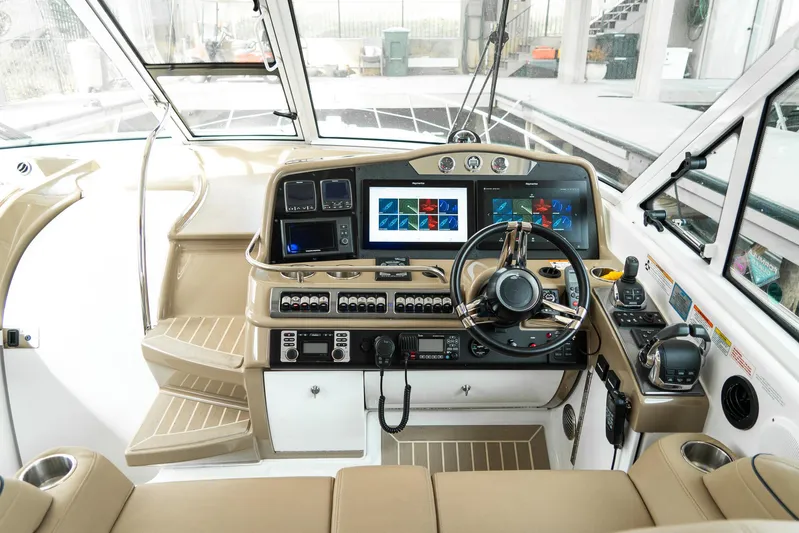  Yacht Photos Pics 2016 Formula 45 Yacht cockpit with advanced navigation systems and luxurious seating.
