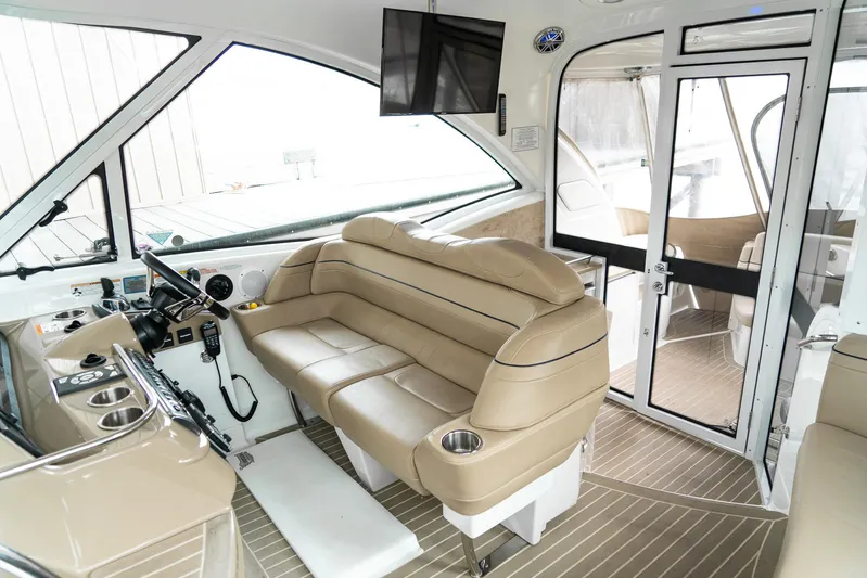  Yacht Photos Pics Interior of 2016 Formula 45 Yacht with beige seating and modern controls.