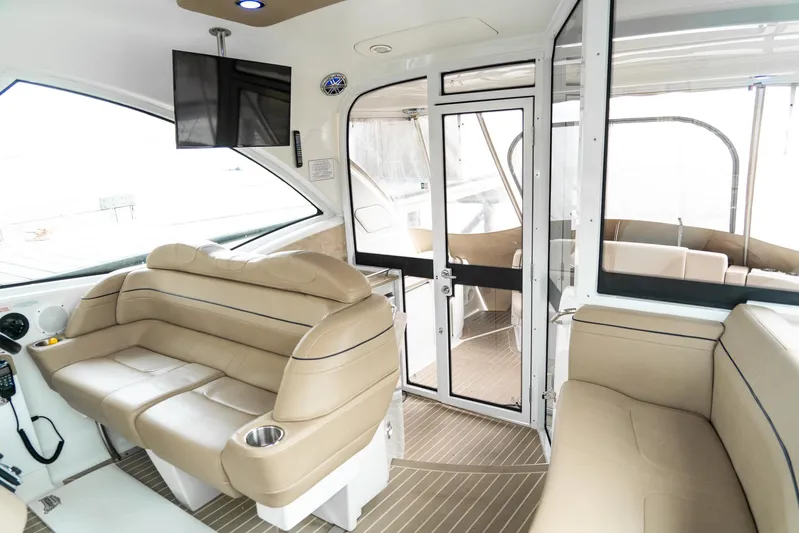  Yacht Photos Pics 2016 Formula 45 Yacht interior with beige seating, modern design, and glass doors.
