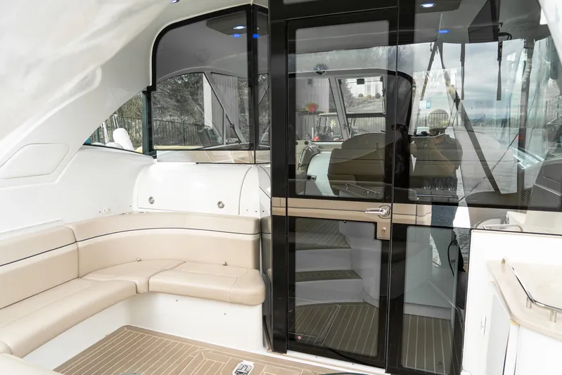  Yacht Photos Pics 2016 Formula 45 Yacht interior with beige seating and glass doors.