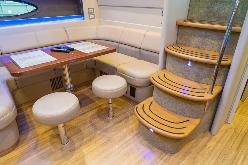  Yacht Photos Pics Luxurious interior of 2016 Formula 45 Yacht with seating and wooden stairs.