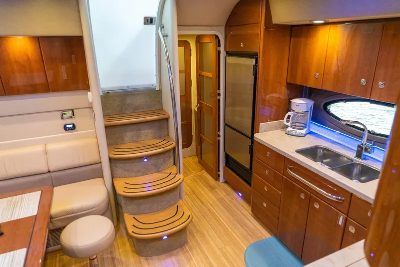 Yacht Photos Pics Luxurious interior of a 2016 Formula 45 Yacht with wooden cabinetry and modern amenities.