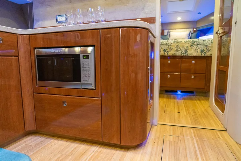  Yacht Photos Pics Interior of 2016 Formula 45 Yacht with wooden cabinetry and modern kitchen amenities.