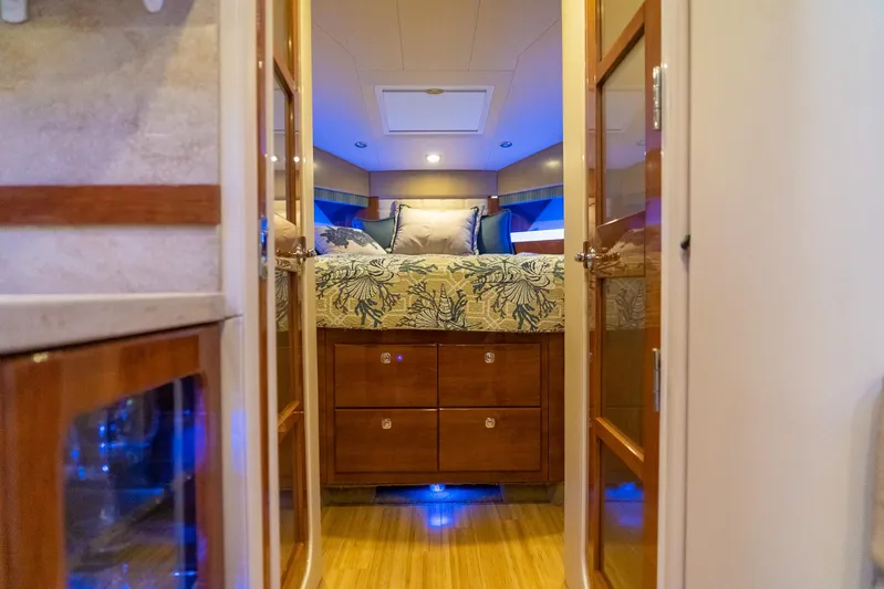  Yacht Photos Pics Luxurious interior of 2016 Formula 45 Yacht with cozy bedroom and elegant wood finishes.