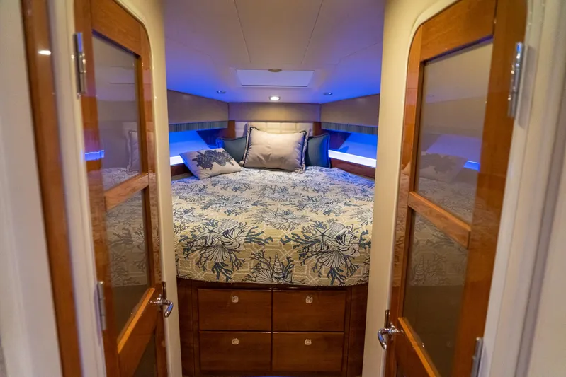  Yacht Photos Pics Luxurious bedroom interior of 2016 Formula 45 Yacht with elegant bedding and wooden accents.