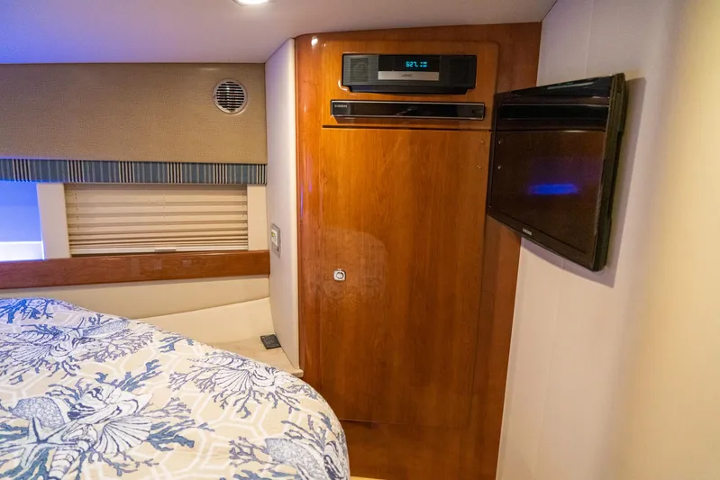  Yacht Photos Pics Interior cabin of 2016 Formula 45 Yacht with wood paneling and TV.