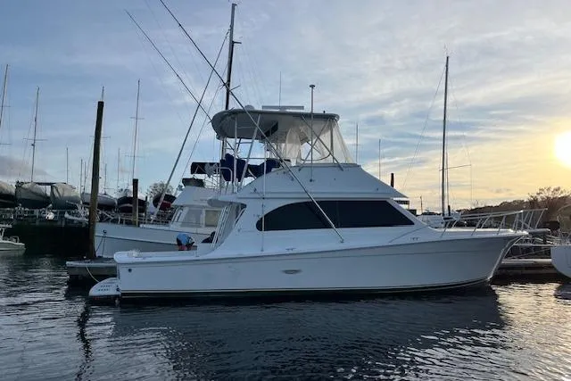 Ronnie H Yacht Photos Pics 2001 Egg Harbor 42 SportYacht docked at marina during sunset.