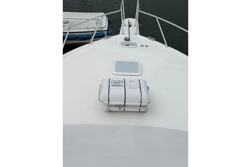 Ronnie H Yacht Photos Pics Bow view of 2001 Egg Harbor 42 SportYacht, featuring deck equipment and railing.