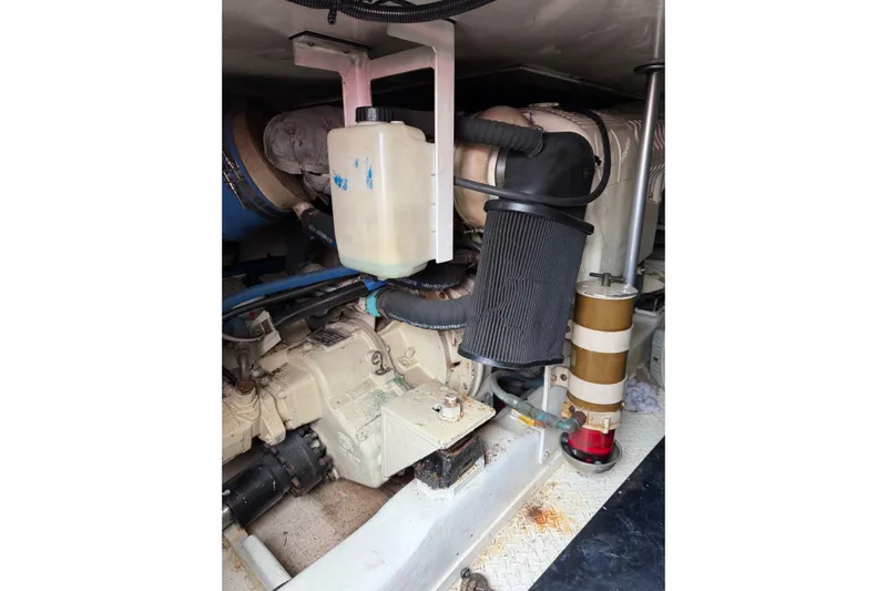 Ronnie H Yacht Photos Pics Engine compartment of a 2001 Egg Harbor 42 SportYacht, showcasing mechanical components and hoses.