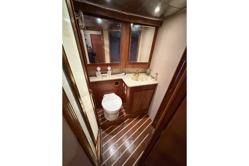 Ronnie H Yacht Photos Pics Luxurious bathroom in 2001 Egg Harbor 42 SportYacht with wood accents and modern fixtures.
