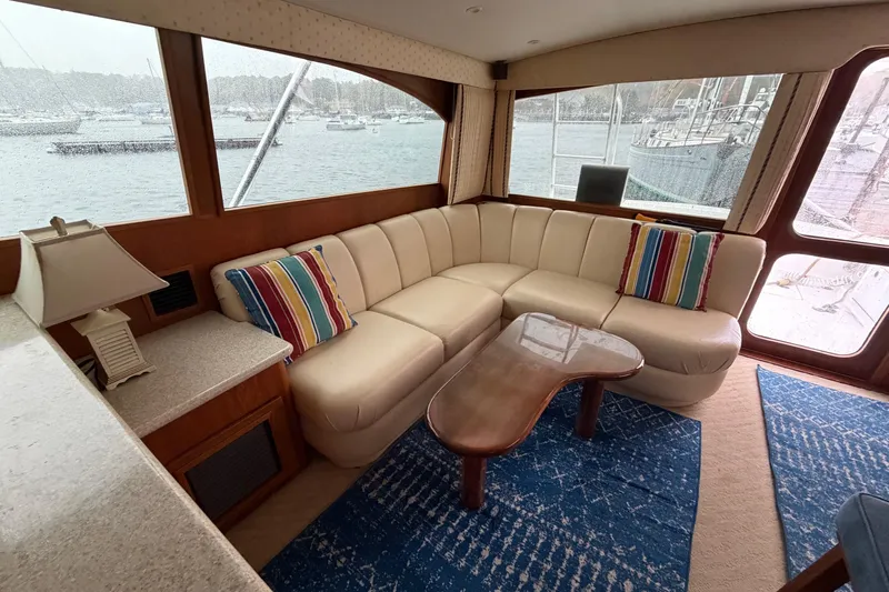 Ronnie H Yacht Photos Pics Luxurious interior of 2001 Egg Harbor 42 SportYacht with leather seating and nautical decor.