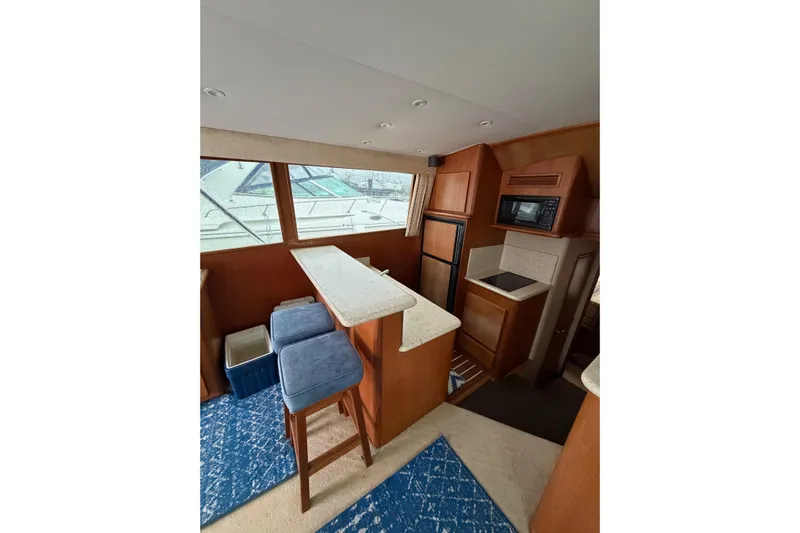 Ronnie H Yacht Photos Pics Interior of 2001 Egg Harbor 42 SportYacht with kitchen and seating area.