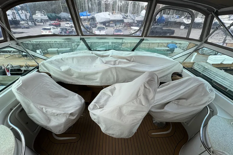  Yacht Photos Pics 2002 Carver 466 Motor Yacht helm with covered seats and panoramic windows.