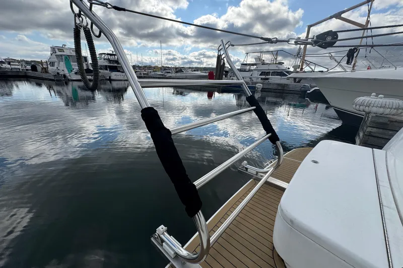  Yacht Photos Pics 2002 Carver 466 Motor Yacht docked at marina under cloudy sky.