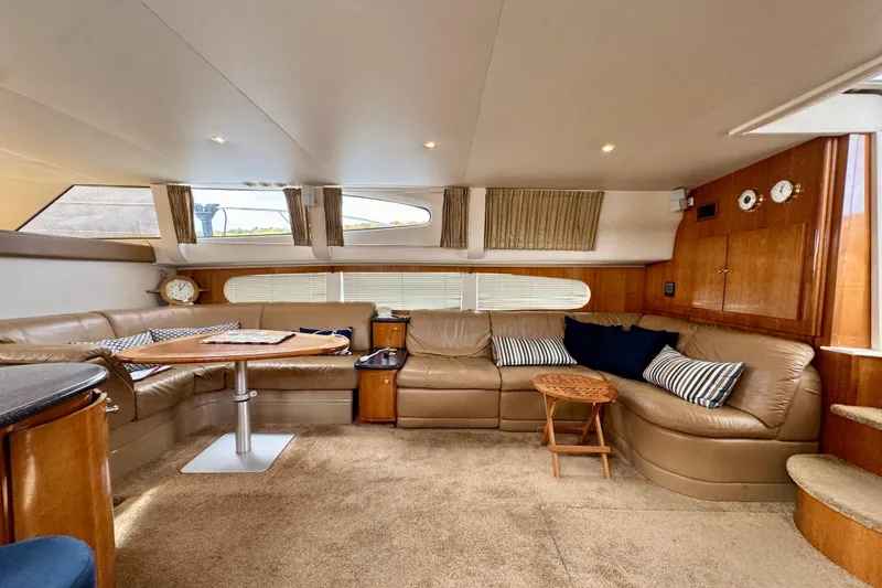  Yacht Photos Pics Luxurious interior of 2002 Carver 466 Motor Yacht with leather seating and elegant decor.