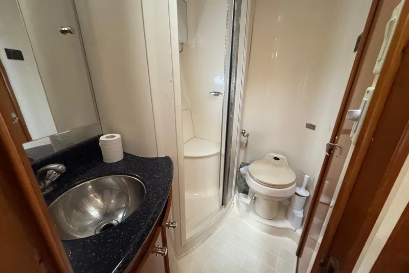  Yacht Photos Pics Bathroom of 2002 Carver 466 Motor Yacht with sink, toilet, and shower.