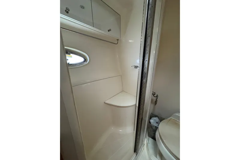  Yacht Photos Pics Bathroom interior of 2002 Carver 466 Motor Yacht with shower and toilet.