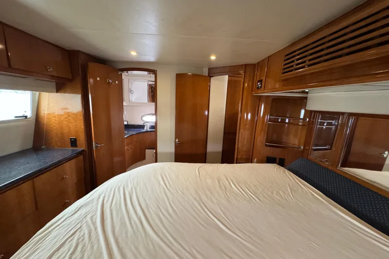  Yacht Photos Pics Luxurious interior of 2002 Carver 466 Motor Yacht with wood cabinetry and spacious layout.