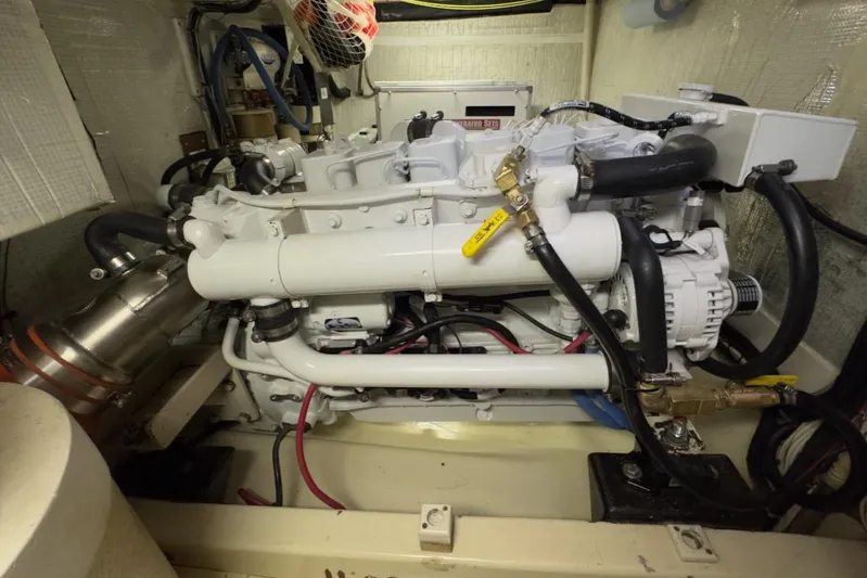 Leto Yacht Photos Pics Engine room of a 2001 American Tug 34, showcasing a well-maintained marine engine.