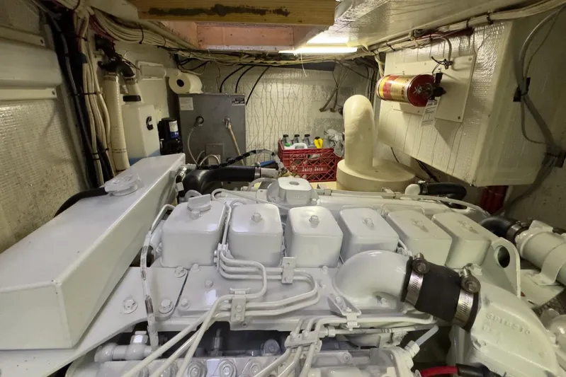 Leto Yacht Photos Pics Engine room of a 2001 American Tug 34, featuring a well-maintained engine and equipment.