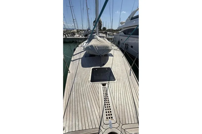  Yacht Photos Pics 2009 Franchini 63 S yacht deck with sleek wooden finish in marina.