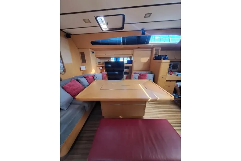  Yacht Photos Pics Luxurious interior of 2009 Franchini 63 S yacht with wooden table and plush seating.