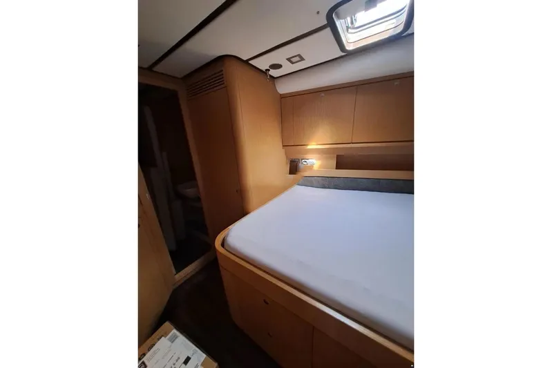  Yacht Photos Pics Luxurious cabin interior of 2009 Franchini 63 S yacht with wooden furnishings.