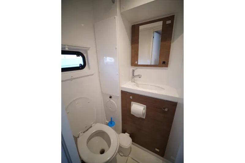 Eagle Yacht Photos Pics Compact bathroom in 2022 Bali 4.8 model, featuring toilet, sink, and mirror.