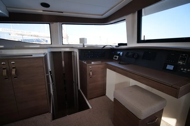 Eagle Yacht Photos Pics Interior of 2022 Bali 4.8 yacht, featuring modern navigation controls and wooden cabinetry.