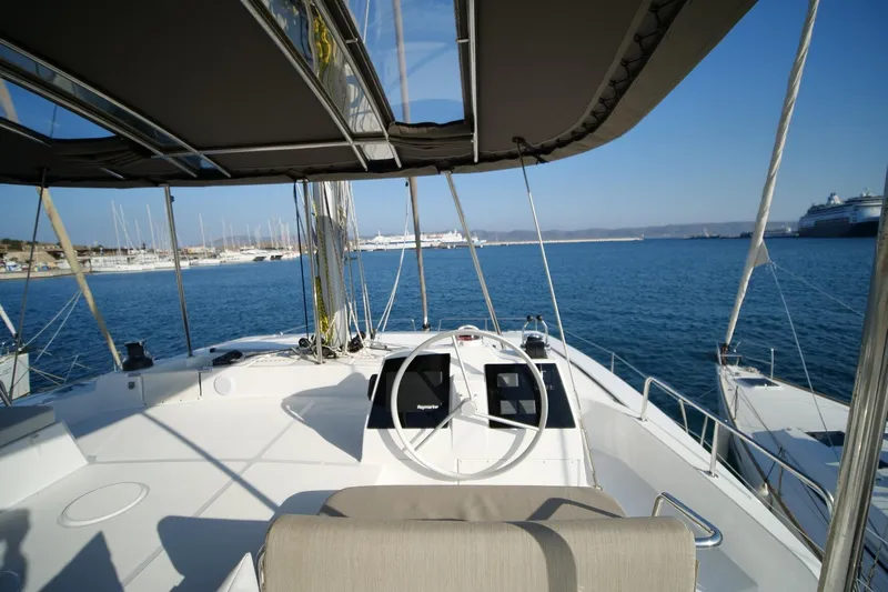 Eagle Yacht Photos Pics 2022 Bali 4.8 catamaran cockpit with ocean view and marina backdrop.