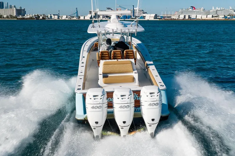 Wahoo Whitney Yacht Photos Pics 2022 Valhalla Boatworks V-37 cruising with triple outboard engines in open water.