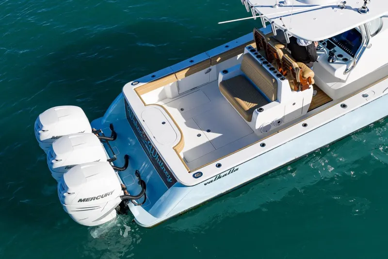 Wahoo Whitney Yacht Photos Pics 2022 Valhalla Boatworks V-37 with triple Mercury engines on clear water.
