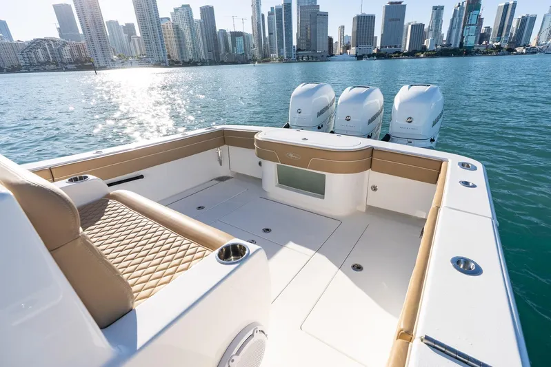 Wahoo Whitney Yacht Photos Pics 2022 Valhalla Boatworks V-37 with triple engines, city skyline in background.