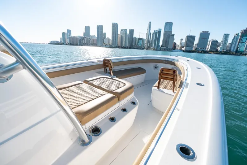 Wahoo Whitney Yacht Photos Pics 2022 Valhalla Boatworks V-37 on water with city skyline in background.
