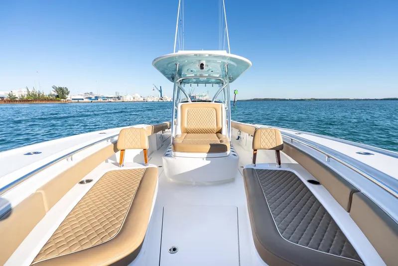 Wahoo Whitney Yacht Photos Pics 2022 Valhalla Boatworks V-37, luxurious seating, open water, clear sky, modern design.