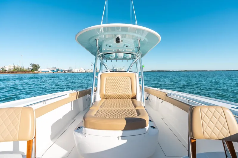 Wahoo Whitney Yacht Photos Pics 2022 Valhalla Boatworks V-37 on water, featuring luxurious tan seating and sleek design.