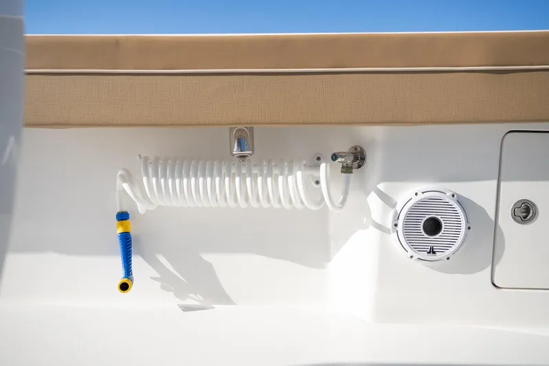 Wahoo Whitney Yacht Photos Pics 2022 Valhalla Boatworks V-37 deck with coiled hose and speaker.